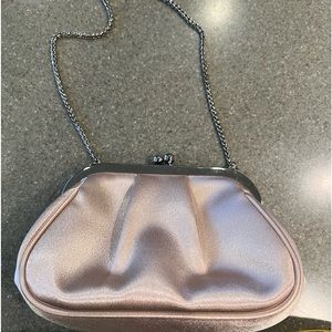 Nina  blush color silk satchel with snake cable.